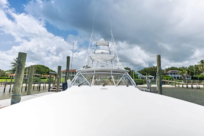 Slide: The Image of 2010 Viking 52 Open yacht docked under cloudy sky. - 39