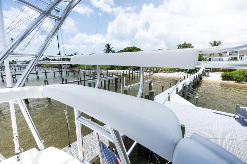 Slide: The Image of 2010 Viking 52 Open yacht docked by a scenic waterfront. - 41