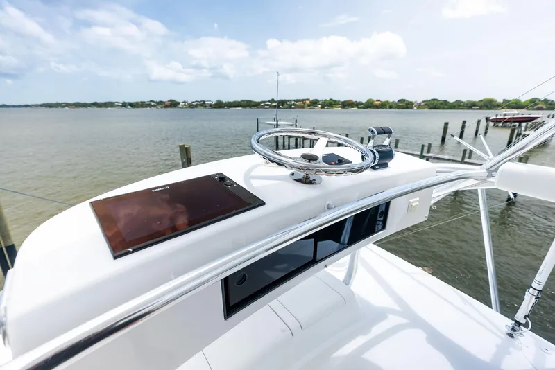 Slide: The Image of Helm of 2010 Viking 52 Open yacht with scenic water view. - 43