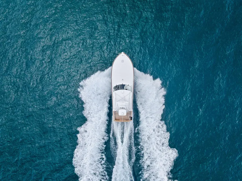 Slide: The Image of Aerial view of 2010 Viking 52 Open yacht cruising on blue ocean waters. - 9