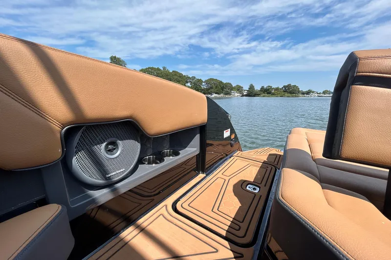 Slide: The Image of 2026 Cobalt R8 Surf boat interior with tan leather seats and lake view. - 20