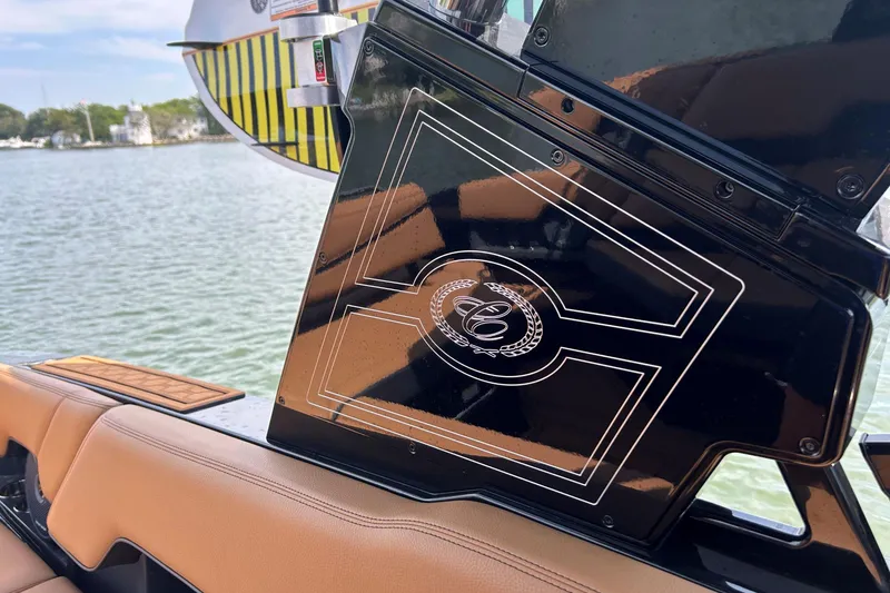 Slide: The Image of 2026 Cobalt R8 Surf boat interior with sleek black panel and elegant design. - 25