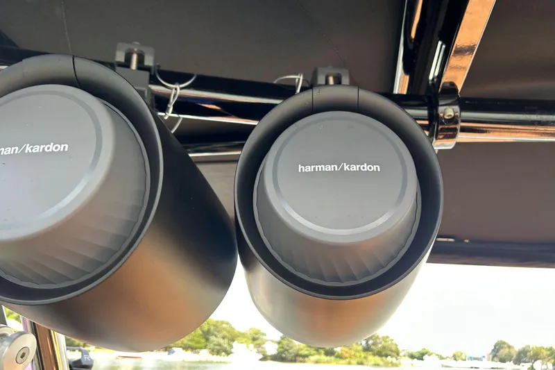 Slide: The Image of Harman Kardon speakers on 2026 Cobalt R8 Surf boat, mounted under a canopy. - 28