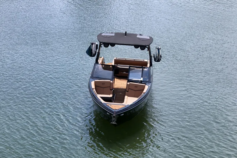 Slide: The Image of 2026 Cobalt R8 Surf boat on calm water, featuring sleek design and spacious seating. - 3