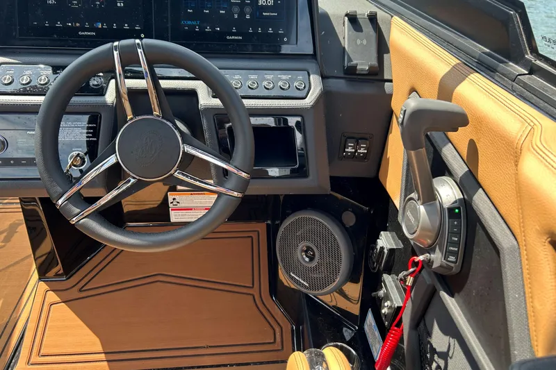Slide: The Image of Interior of 2026 Cobalt R8 Surf boat with steering wheel and controls. - 33