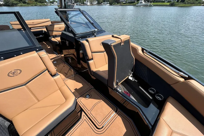 Slide: The Image of Luxurious interior of 2026 Cobalt R8 Surf boat with tan leather seating. - 39