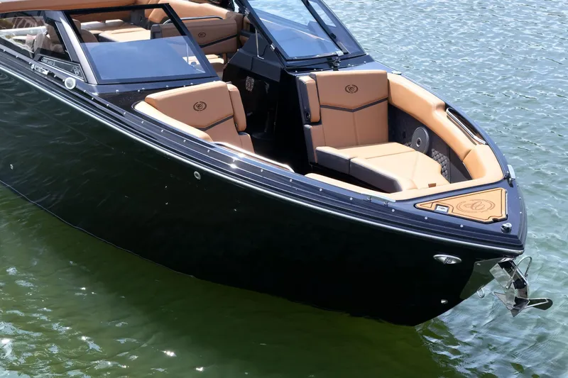Slide: The Image of 2026 Cobalt R8 Surf boat with sleek design and luxurious seating on water. - 43