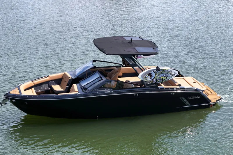 Slide: The Image of 2026 Cobalt R8 Surf boat on water, featuring sleek design and modern amenities. - 5