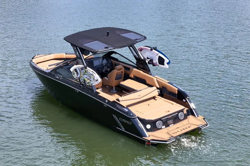 Slide: The Image of 2026 Cobalt R8 Surf boat on water, featuring sleek design and luxurious interior. - 7
