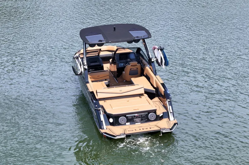 Slide: The Image of 2026 Cobalt R8 Surf boat on water, featuring sleek design and luxurious seating. - 8