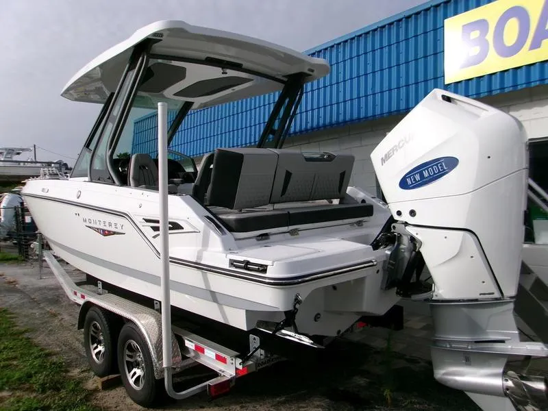 Slide: The Image of 2025 Monterey Elite 27 OB boat with outboard motor on trailer. - 10
