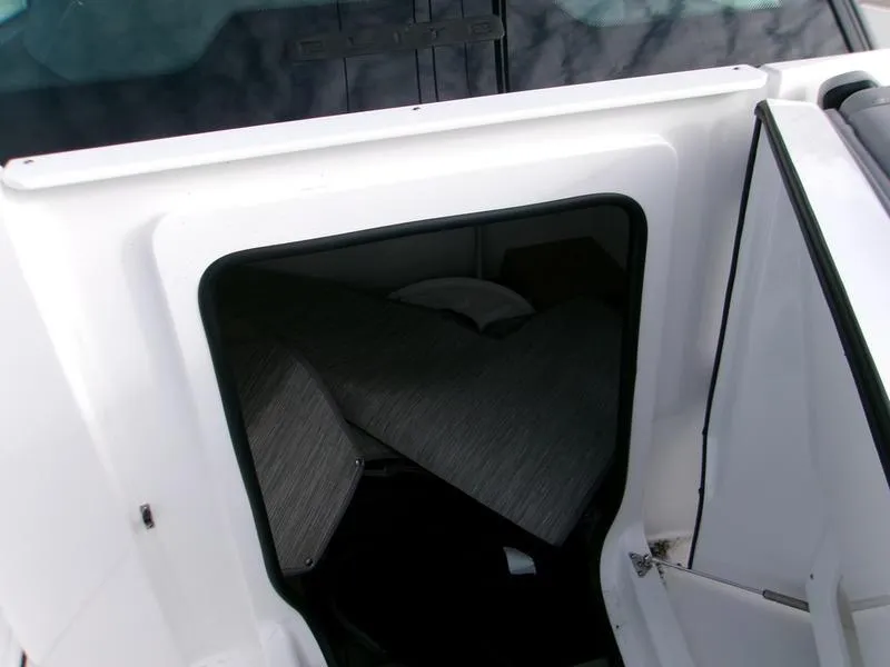 Slide: The Image of 2025 Monterey Elite 27 OB cabin interior with seating area. - 14