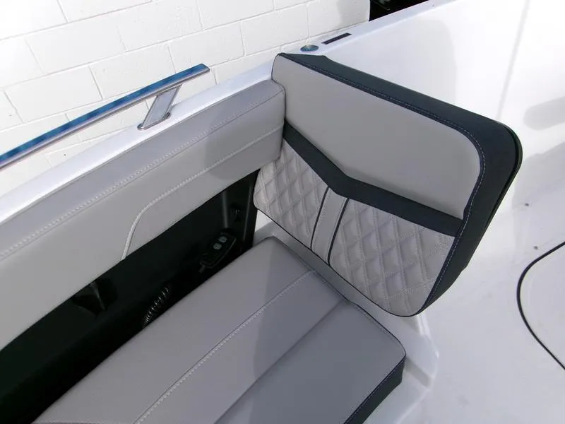 Slide: The Image of 2025 Monterey Elite 27 OB boat interior with stylish gray seating and quilted design. - 16