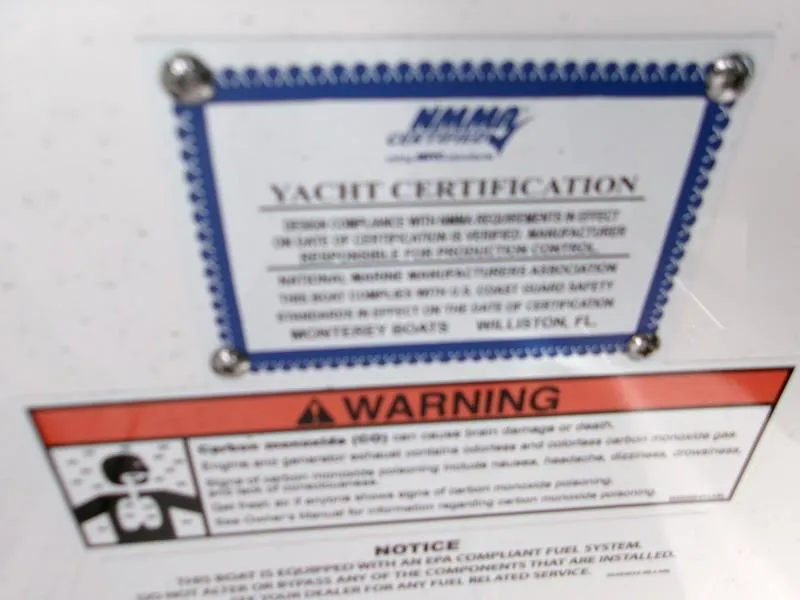 Slide: The Image of Yacht certification and warning labels on a 2025 Monterey Elite 27 OB boat. - 5