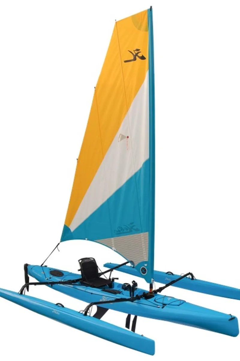 Slide: The Image of 2025 Hobie Adventure Island sailboat with vibrant blue and yellow sail design. - 2