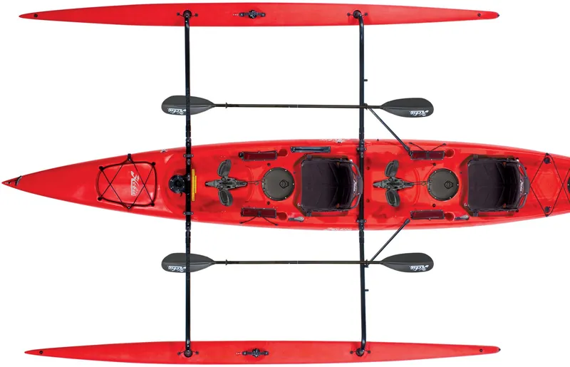 Slide: The Image of 2025 Hobie Adventure Island kayak, red, top view, featuring dual seats and paddles. - 3