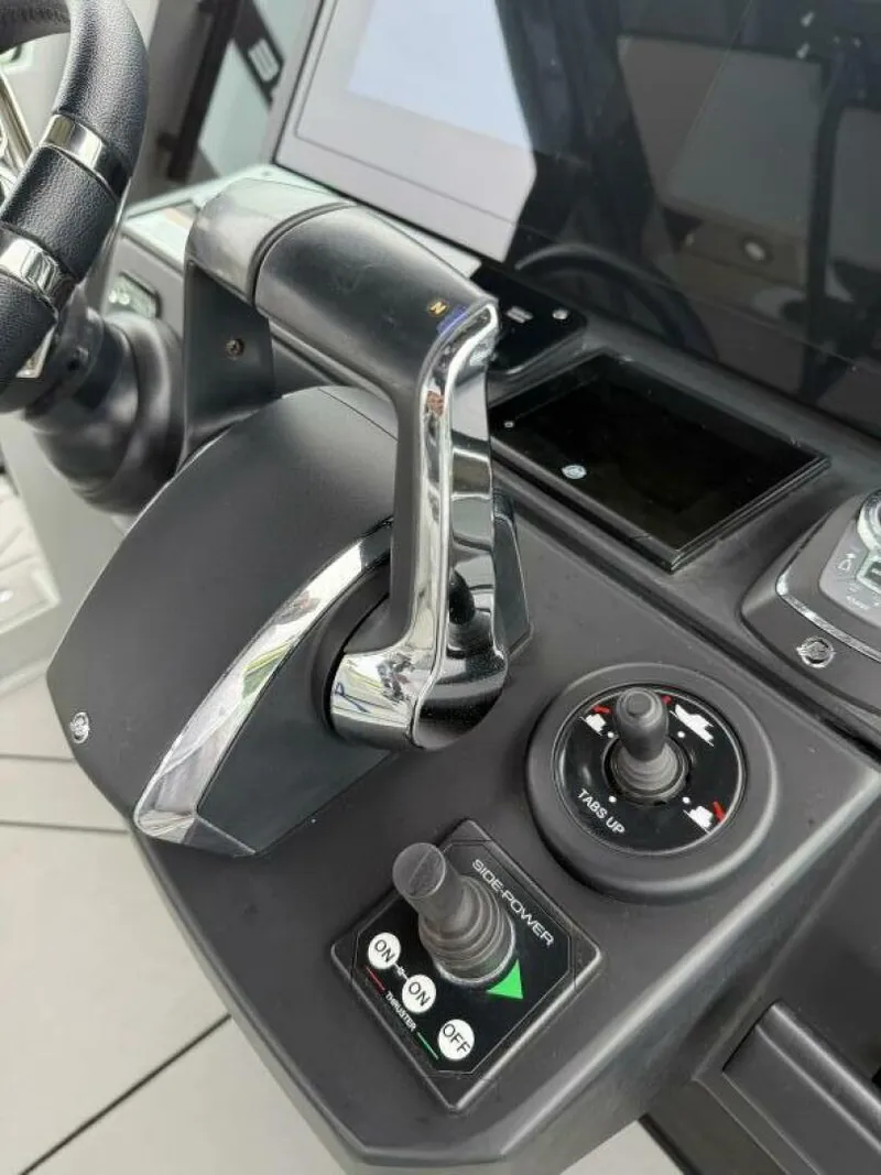 Slide: The Image of Control panel of 2022 Axopar 37 XC CROSS CABIN with throttle and joystick. - 11