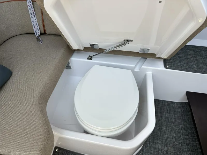 Slide: The Image of 2022 Axopar 37 XC CROSS CABIN interior with hidden toilet under seat. - 16