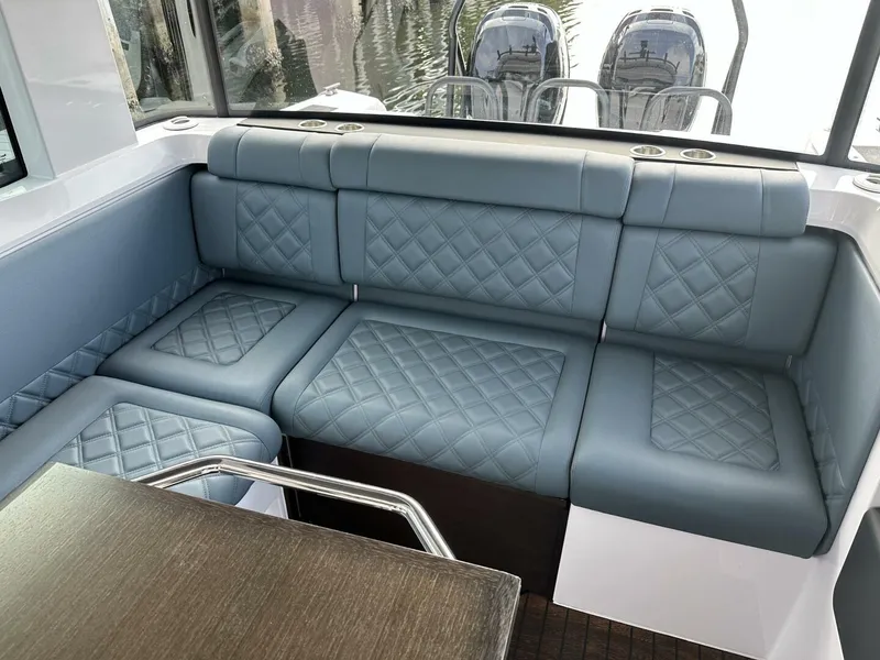 Slide: The Image of Luxurious seating in 2022 Axopar 37 XC CROSS CABIN with quilted upholstery and sleek design. - 6