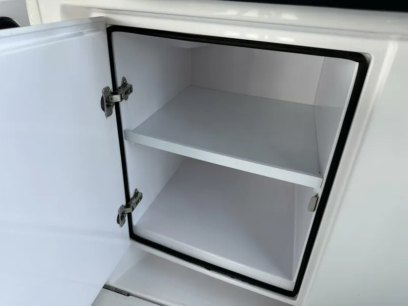 Slide: The Image of Open storage compartment in 2022 Axopar 37 XC CROSS CABIN boat. - 9