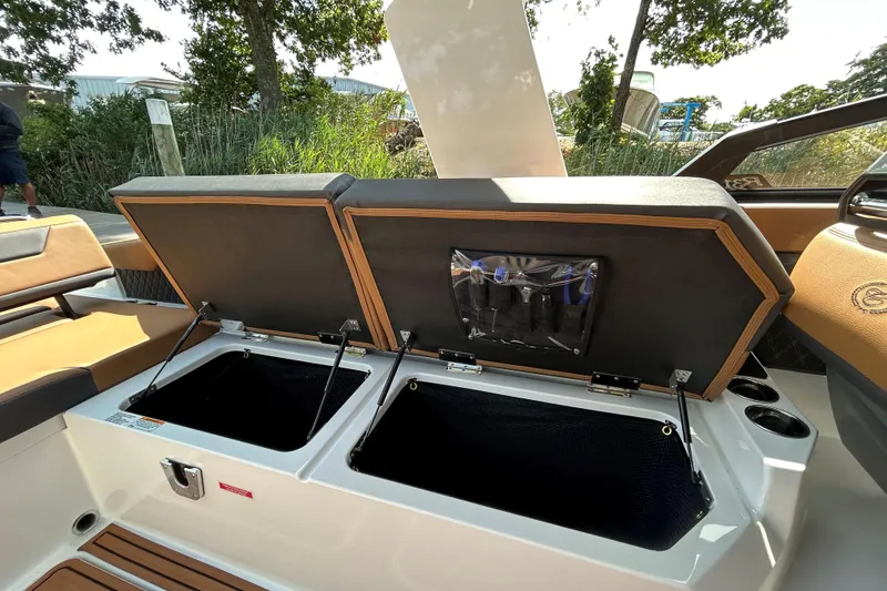 Slide: The Image of 2026 Cobalt R31 boat cruising on calm water, featuring luxurious seating and sleek design. - 12