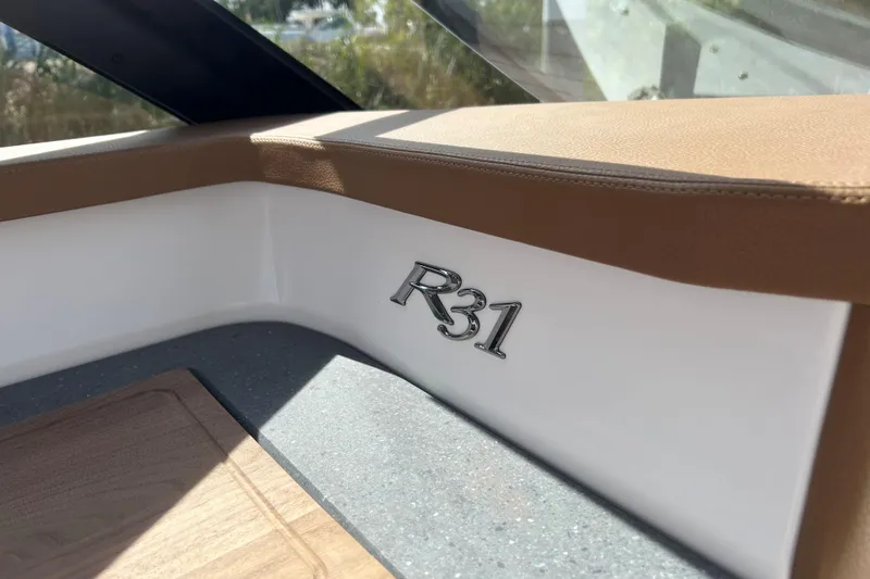 Slide: The Image of Steering wheel and dashboard of 2026 Cobalt R31 boat with navigation display. - 22