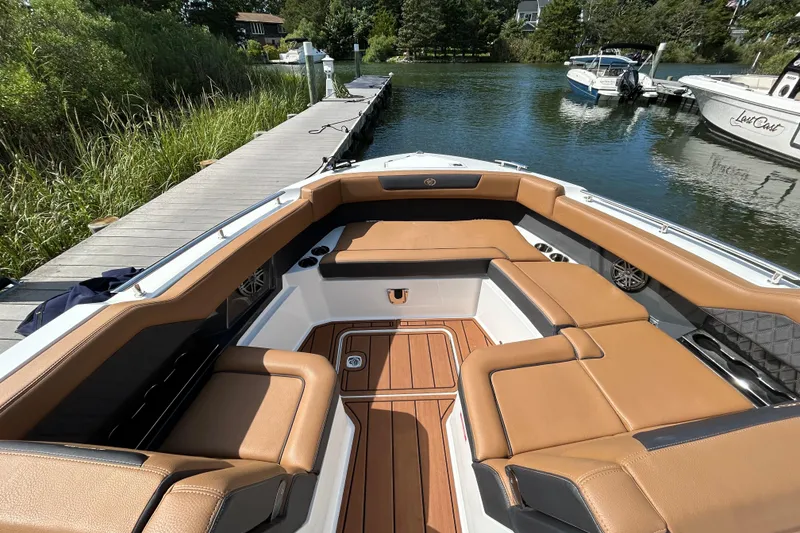 Slide: The Image of 2026 Cobalt R31 boat dashboard with dual screens and steering wheel. - 23