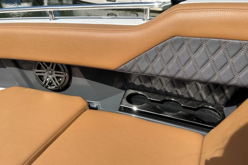Slide: The Image of 2026 Cobalt R31 boat interior with steering wheel, control panel, and modern dashboard features. - 24