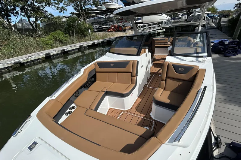 Slide: The Image of Interior of 2026 Cobalt R31 boat featuring compact kitchen and seating area. - 27