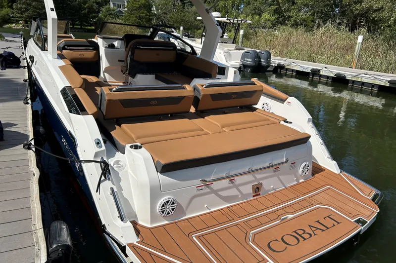 Slide: The Image of 2026 Cobalt R31 boat on calm water, featuring sleek design and modern amenities. - 3