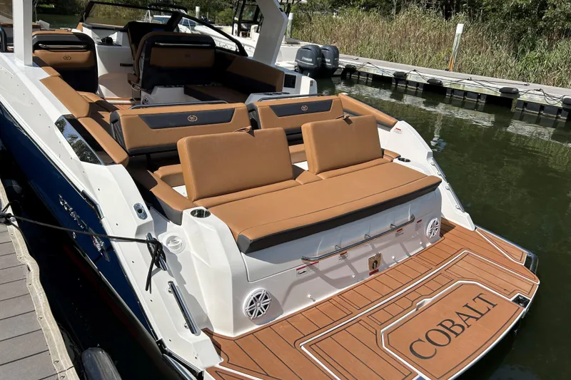 Slide: The Image of 2026 Cobalt R31 boat on water, featuring sleek design and spacious seating. - 4