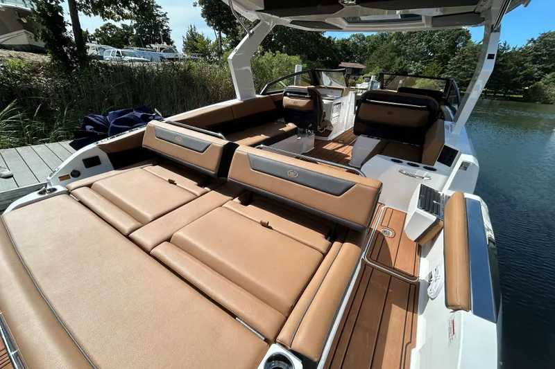 Slide: The Image of Aerial view of 2026 Cobalt R31 boat on calm water. - 9