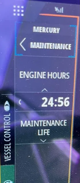 Slide: The Image of Display screen showing Mercury maintenance details, engine hours at 24:56, on a 2023 Sea Ray SPX 210 OB. - 14