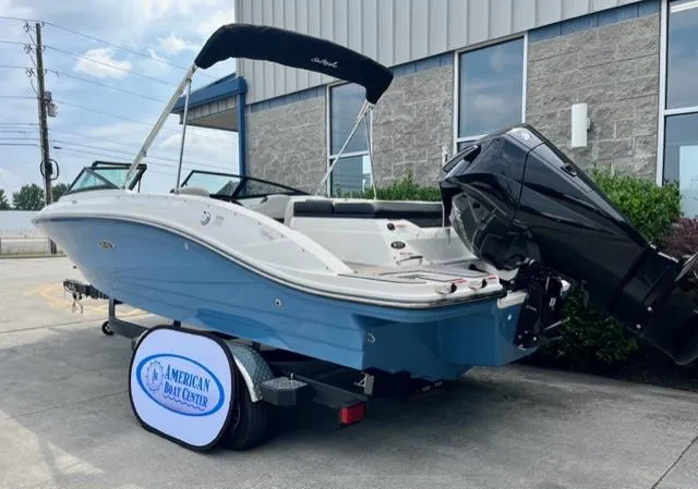 Slide: The Image of 2023 Sea Ray SPX 210 OB boat on trailer, displayed outdoors. - 3