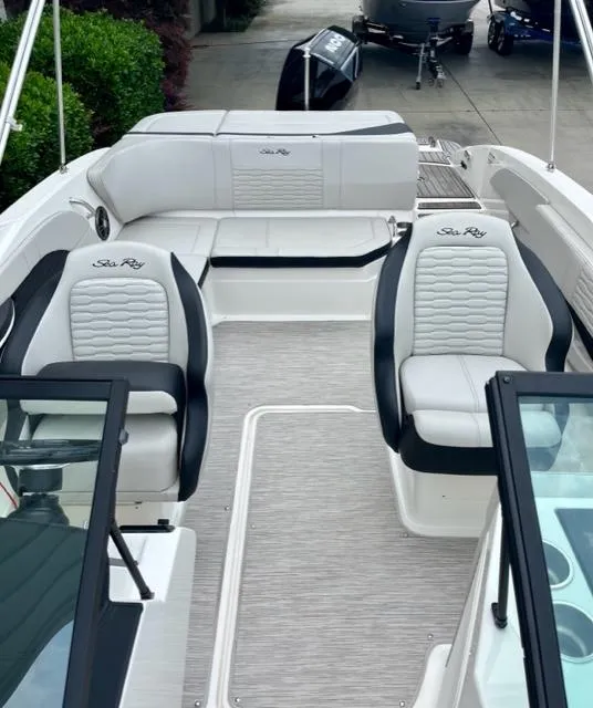 Slide: The Image of 2023 Sea Ray SPX 210 OB boat interior with stylish seating and modern design. - 8