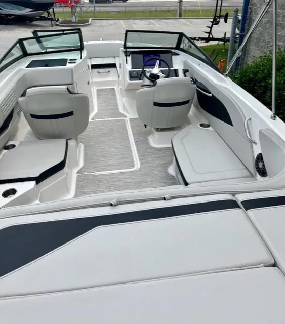 Slide: The Image of 2023 Sea Ray SPX 210 OB boat interior with modern seating and sleek design. - 9