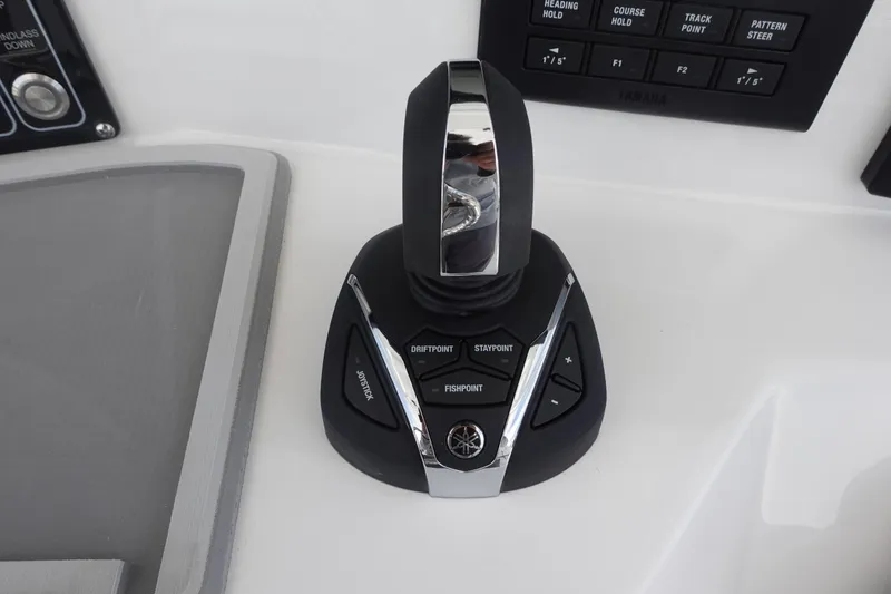 Slide: The Image of Joystick control on 2025 Sea Fox 328 Commander boat dashboard. - 10