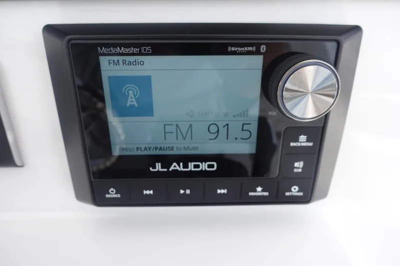 Slide: The Image of JL Audio MediaMaster display on 2025 Sea Fox 328 Commander, tuned to FM 91.5. - 11