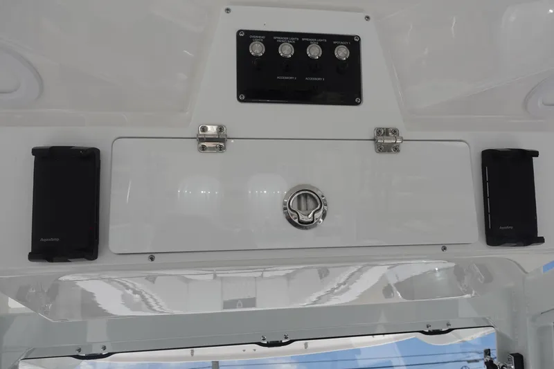 Slide: The Image of Control panel of 2025 Sea Fox 328 Commander boat with switches and speakers. - 12