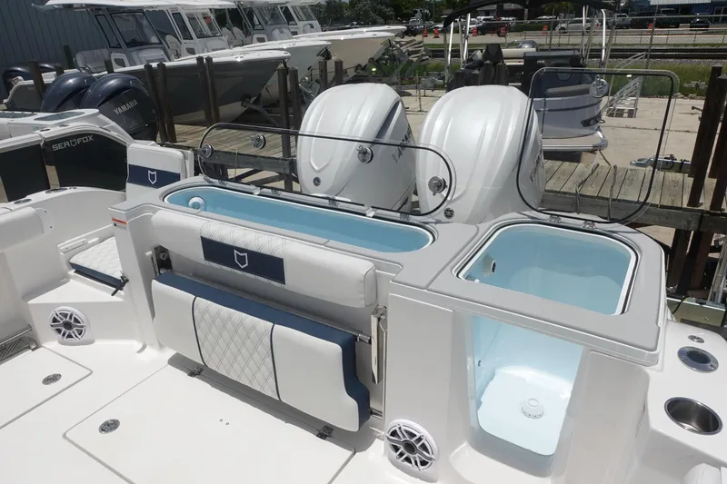 Slide: The Image of 2025 Sea Fox 328 Commander boat with dual engines and spacious deck layout. - 13