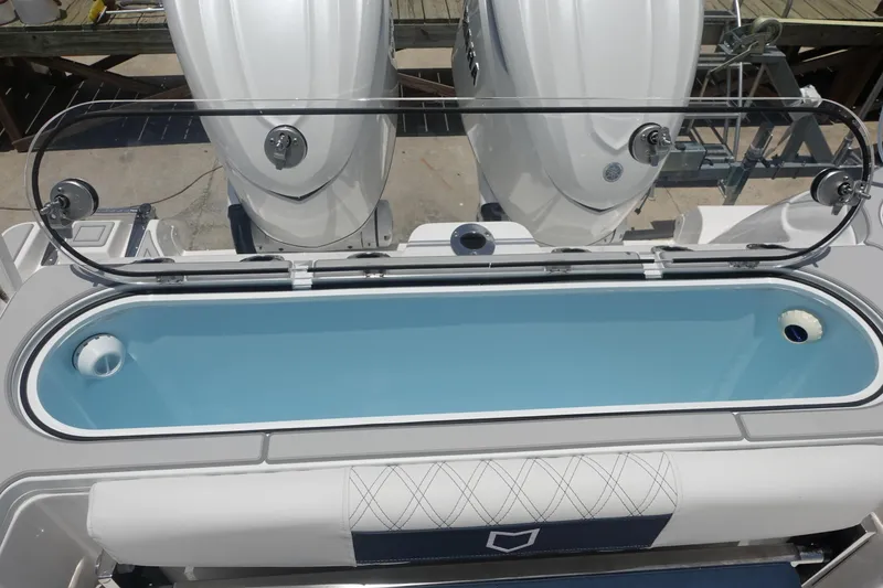 Slide: The Image of 2025 Sea Fox 328 Commander boat with open livewell and dual engines. - 14