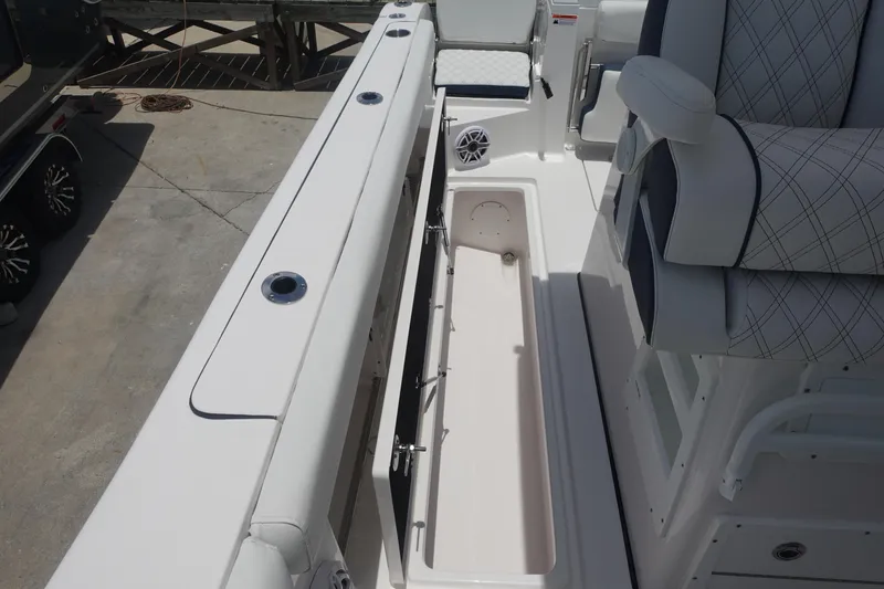 Slide: The Image of 2025 Sea Fox 328 Commander boat interior with storage compartment and seating. - 18