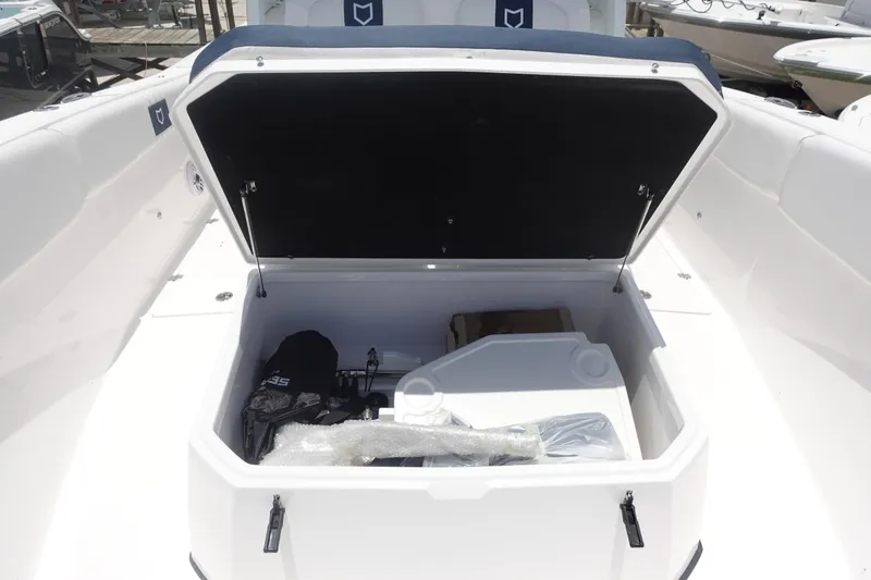 Slide: The Image of 2025 Sea Fox 328 Commander boat storage compartment open, showcasing spacious interior. - 25