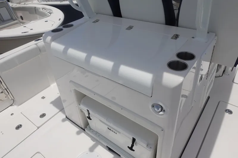 Slide: The Image of 2025 Sea Fox 328 Commander boat interior with storage and cup holders. - 28