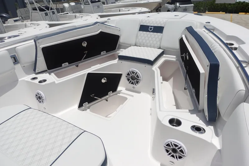 Slide: The Image of 2025 Sea Fox 328 Commander boat interior with open storage compartments and seating. - 5