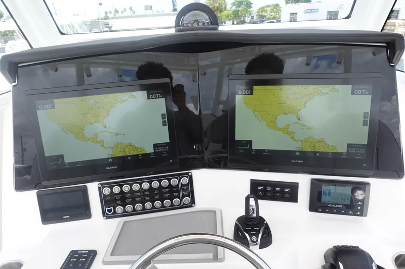 Slide: The Image of Dashboard of 2025 Sea Fox 328 Commander with dual navigation screens and controls. - 6