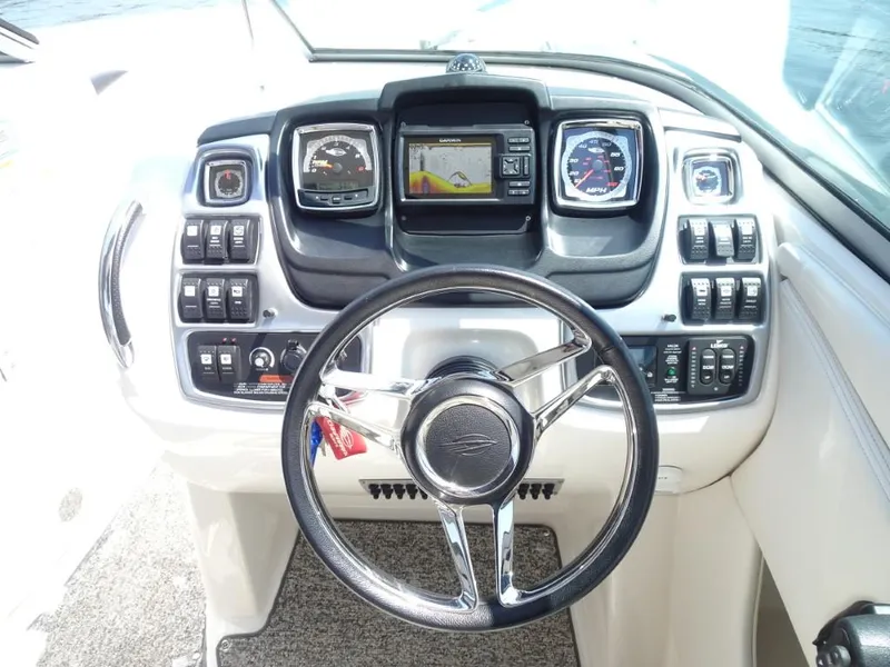 Slide: The Image of Steering console of 2014 Chaparral 287 SSX boat with modern controls and displays. - 15