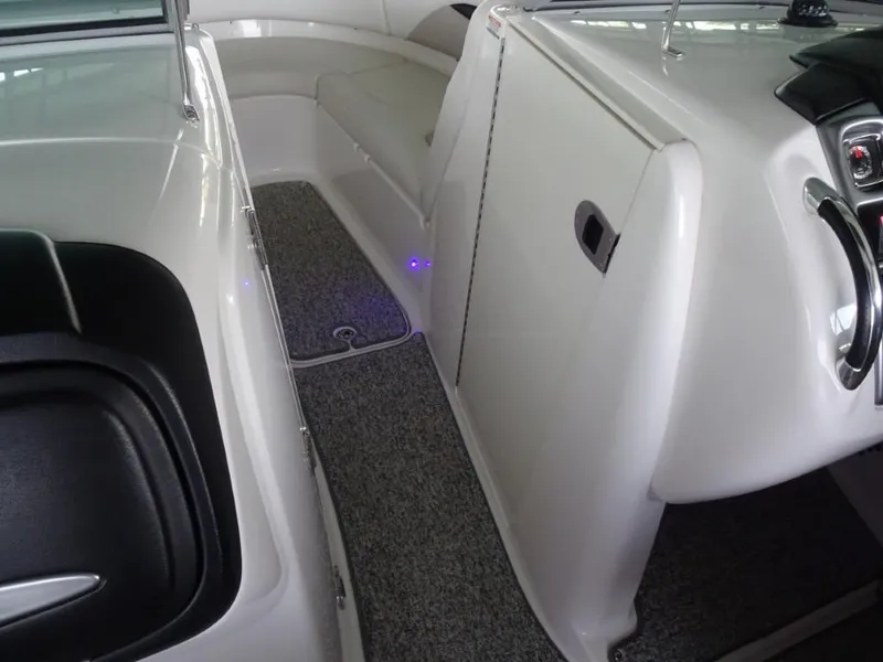 Slide: The Image of Interior view of a 2014 Chaparral 287 SSX boat, featuring sleek seating and modern design. - 20