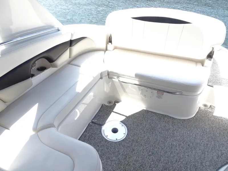 Slide: The Image of 2014 Chaparral 287 SSX boat interior with white seating and gray carpet. - 25