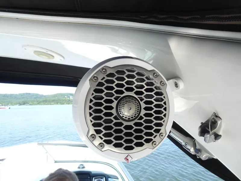 Slide: The Image of Speaker on 2014 Chaparral 287 SSX boat, overlooking a scenic lake view. - 27
